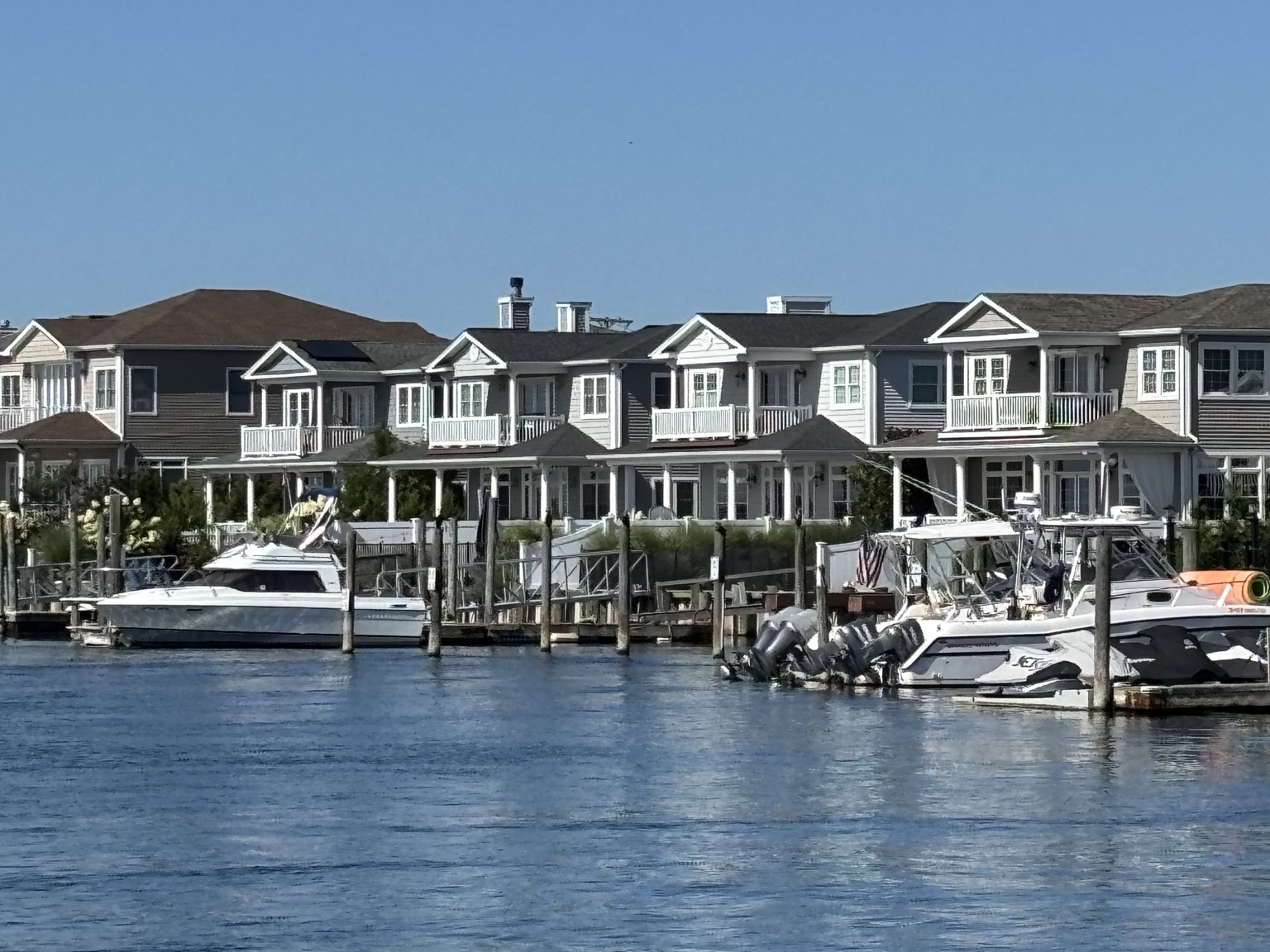 Long Island waterfront homes and boats viewed across the bay